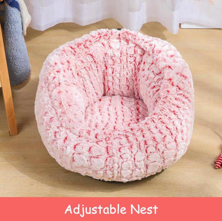 Pink plush pet bed with cat curled inside