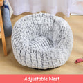 Grey plush pet bed with cat curled inside