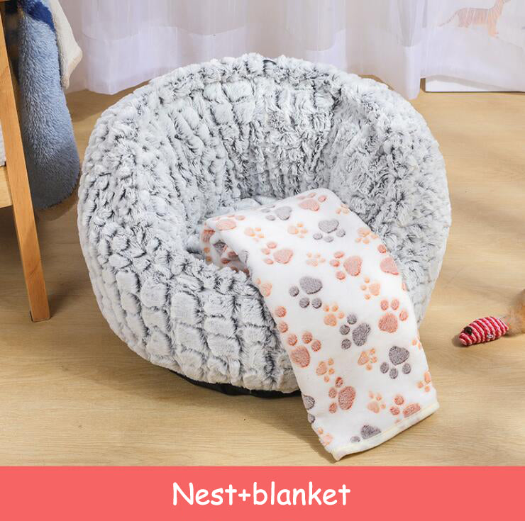 Grey plush pet bed with cat curled inside